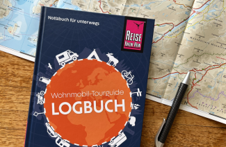Wohnmobil-Tourguide Logbuch mit Landkarte und Kugelschreiber